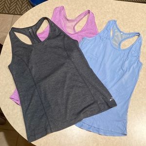 **Bundle of 3** Small athletic tanks.